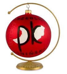 Czerwona bombka z czarnym logo na stojaku